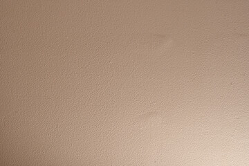 Background and textured of Interior cement wall with cream color paint.