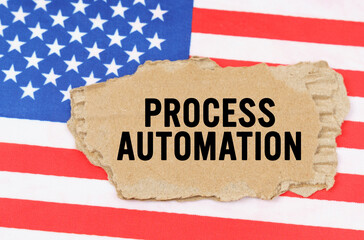 On the US flag lies a cardboard box with the inscription- PROCESS AUTOMATION