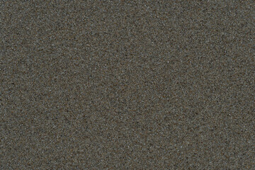 Background and textured of wet sand in the sandy beach.