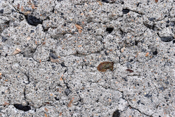 The surface of an old cinder block falling apart
