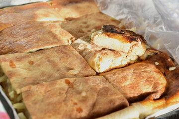Ready and baked meat pie on a baking sheet