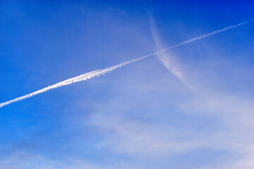 Blue evening sky and inversion trail from the plane