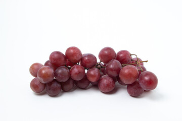 Grapes on a white background. Isolated pink grapes. Bunch of grapes