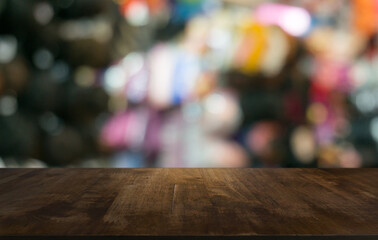 Empty wooden table in front of abstract blurred background of coffee shop . can be used for display or montage your products.Mock up for display of product