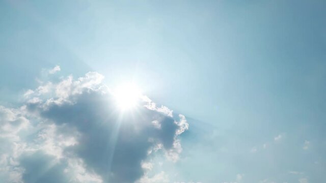 Bright sun light ray flare n sunbeam shined through dark cumulus cloud on Beautiful sunny clear blue sky in tropical summer sunlight n sunray at daylight sunshine day, 4k cinemagraphs b-roll TimeLapse