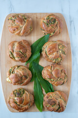 home made bread rolls with wild garlic on a table