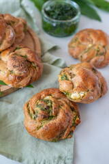 home made bread rolls with wild garlic on a table
