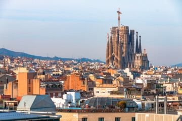 Picture of Sagrada Familia designed by Gaudí captured in a sunny day from a high building in...
