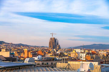 Naklejka premium Picture of Sagrada Familia designed by Gaudí captured in a sunny day from a high building in Barcelona, Spain. 
