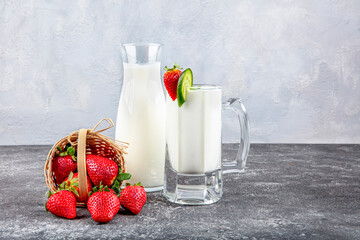 Healthy Organic Drinkable Yogurt Kefir in a Glass. Close-up shot on a full glass of white Kefir...