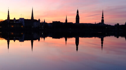 Fototapeta na wymiar Spring sunrise over old Riga reflected in the mirror of the Daugava