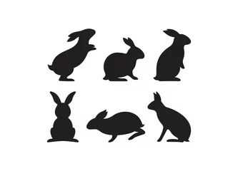 Fototapeten Silhouettes of rabbits isolated on a white background. Rabbits in various poses © TRI