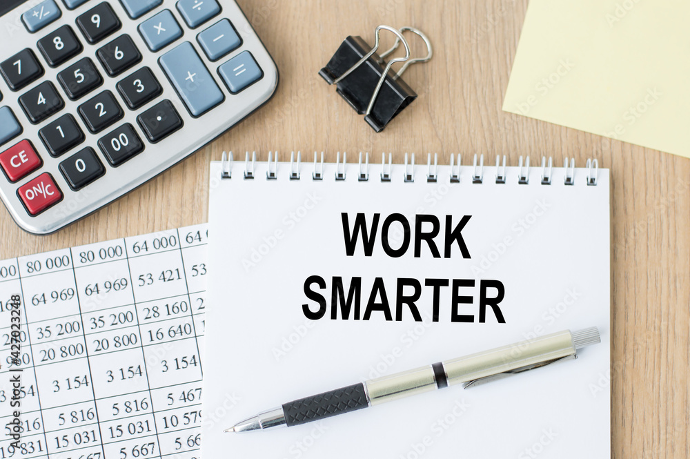 Poster work smarter text written on a notebook on the office desk