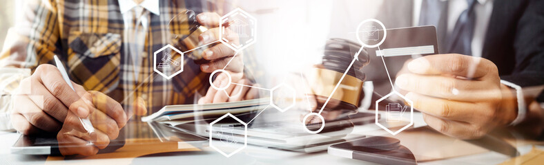 justice and law concept.Male judge in a courtroom on wooden table and Counselor or Male lawyer working in office. Legal law, advice and justice concept.