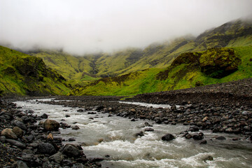 River and moss covered lava rocks in Seljavellir valley, near Seljavallalaug, Iceland