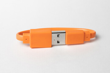  Orange USB cabel isolated on grey background