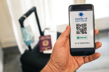 Close up view new immunity covid-19 health passport with boarding pass to travel. Documents needed to journey after being vaccinated. Documented vaccine administration against coronavirus to fly safe.