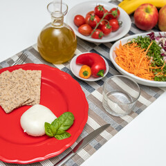 Nutritious dishes prepared with mozzarella salad and tomatoes. Natural and healthy ingredients of the Mediterranean diet: olive oil, cereals, peppers, vegetables, fruit and cheese. Farmers products