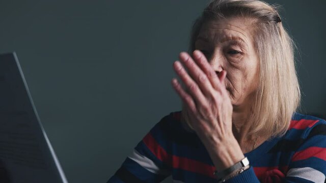 Elderly woman reading doctor report. Positive test on covid19. High quality 4k footage