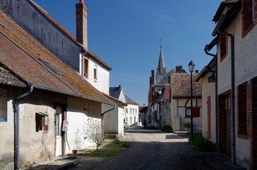 Fototapeta na wymiar View of a quiet street in an old french village