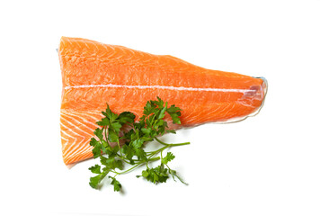 Salmon fillet meat with parsley isolated on white background. Horizontal section of a fish.