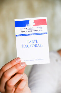 Marseille, France – March 19, 2017: woman holding a french election card to vote in the presidential elections