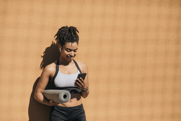 Fitness, yoga, pilates workout outside and mobile app for sports