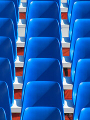 Fototapeta premium seats,chairs,empty,nobody,blue,repetition,outdoors,places,place,seat,chair,plastic