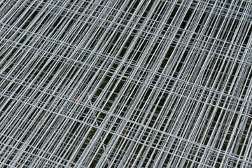 detail of galvanized construction site fencing in a pile on the floor