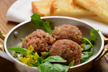 A plated dish of Ahi Tuna Tartar and toasted bread
