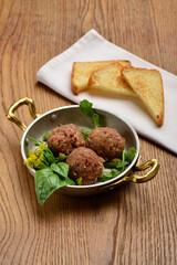 A plated dish of Ahi Tuna Tartar and toasted bread