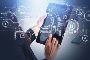 Young businesswoman wearing formal suit is touching tablet