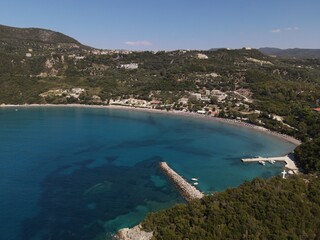 Naklejka premium Aerial Shot: Arilla Exotic Beach of Perdika Town Greece, Epirus, Thesprotia 