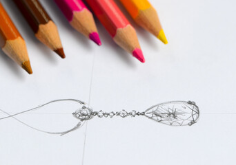the sketch is designing jewelry pendant.
