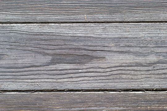 Gray board, wood texture, wooden background, damaged, cracked.