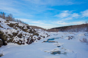 Fototapeta na wymiar Dawn in the Urals in nature. Landscape with the Ural taiga in winter.