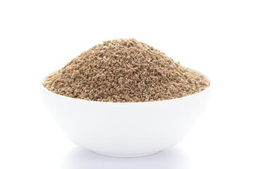  close-up of Organic Ajwain seed (Trachyspermum ammi) or thymol seeds on a ceramic white bowl. ...