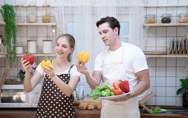 Couples having fun together while cooking in the kitchen, Eating good food for good health.