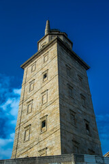 Fototapeta na wymiar La llamada Torre de Hércules, el faro de origen romano más antiguo y mejor conservado del mundo, en uso hasta hace pocos años y actualmente visitable en la ciudad de La Coruña, España