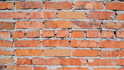 brick old wall of uneven red brick