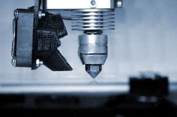Modern 3D printer printing figure close-up. Automatic three dimensional