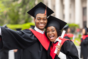 Happy african american couple students taking selfie, closeup