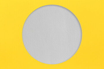 Yellow paper is placed on top of the Gray paper and circle shape.