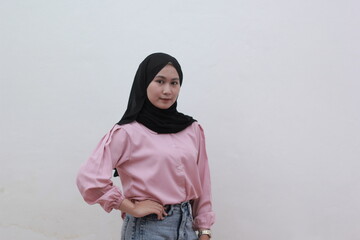 Portrait of beautiful confident young Asian woman has an cute face on white background. Beautiful asian woman with casual dress. Beautiful muslim women. 