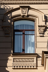 Windows on old city facades, with decorative elements