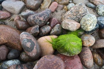 the pile of stones and rocks on the beach in Jaroslawiec, Poland, Baltic Sea 