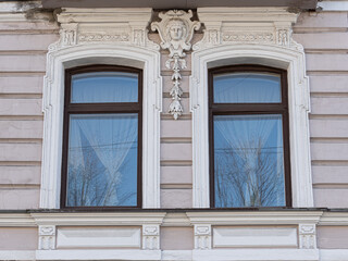 Windows on old city facades, with decorative elements