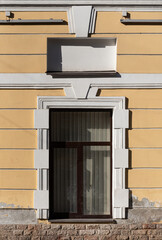 Windows on old city facades, with decorative elements