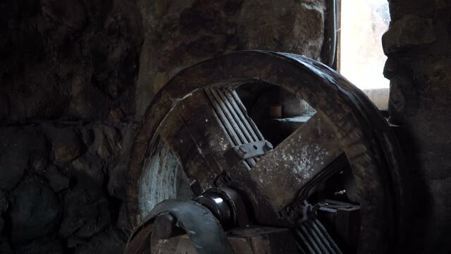 The internal mechanism of an old mill. A wheel inside a windmill or river mill. Ancient flour production. Milling of wheat, corn, rye.