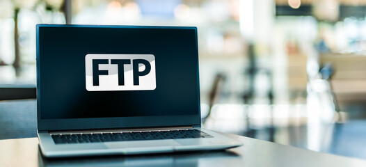 Laptop computer displaying a sign of the ftp